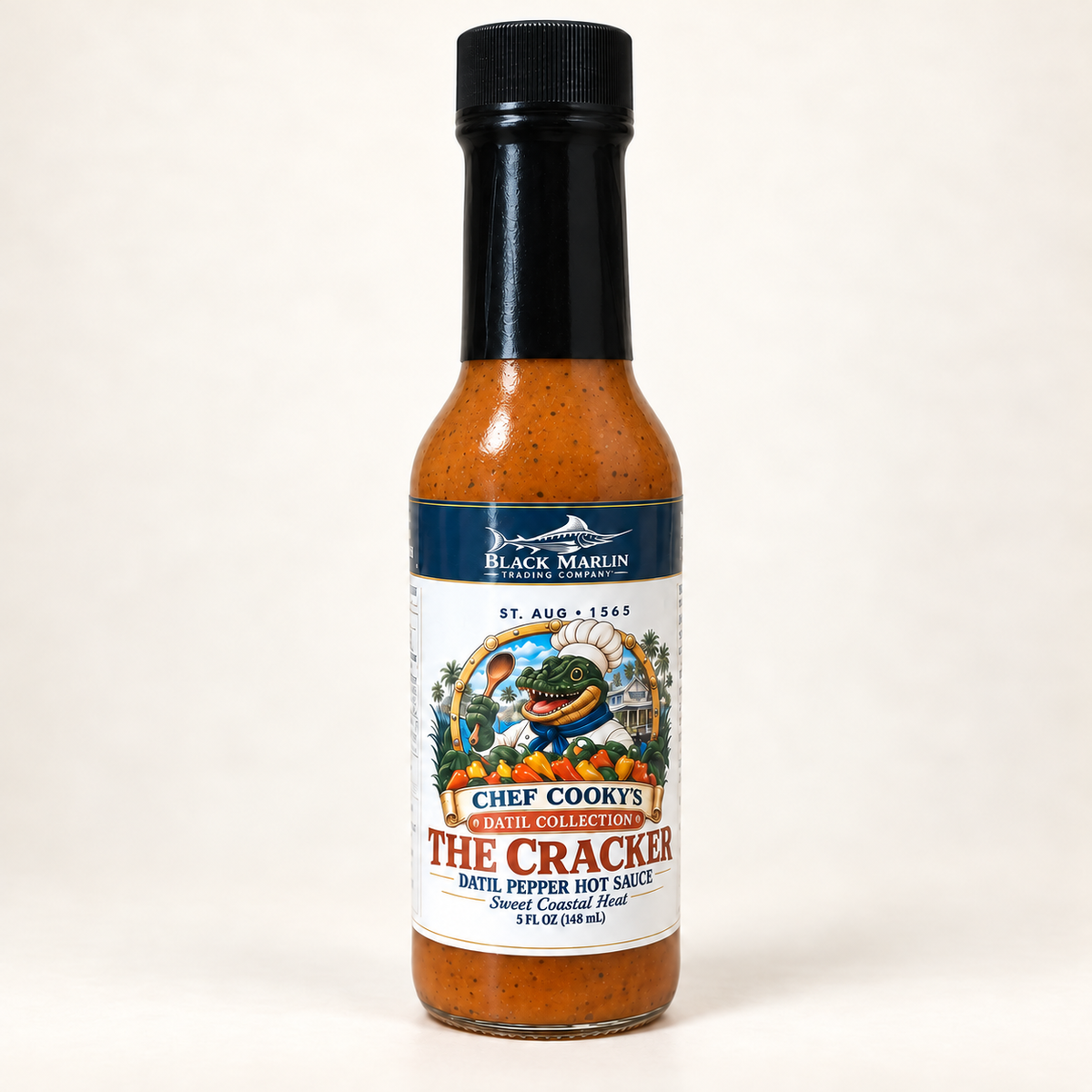 Datil Hot Sauce in a 5 fl oz glass bottle with a black cap and the Black Marlin Chef Cooky's label
